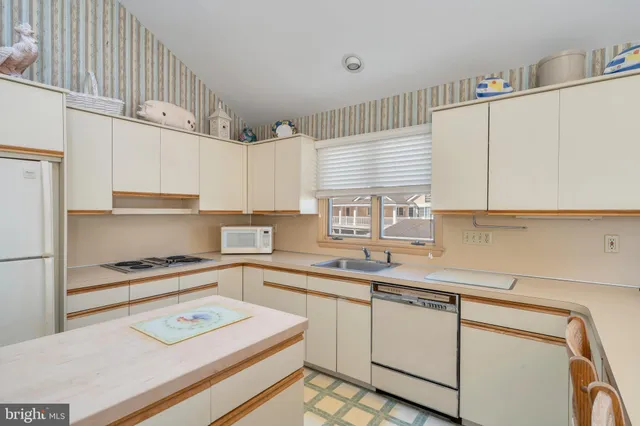 a bedroom with a large bed and a couch