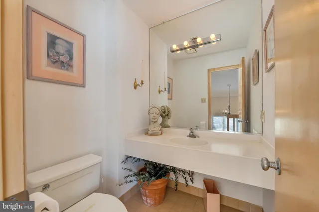 a spacious bathroom with a double vanity sink mirror and bathtub