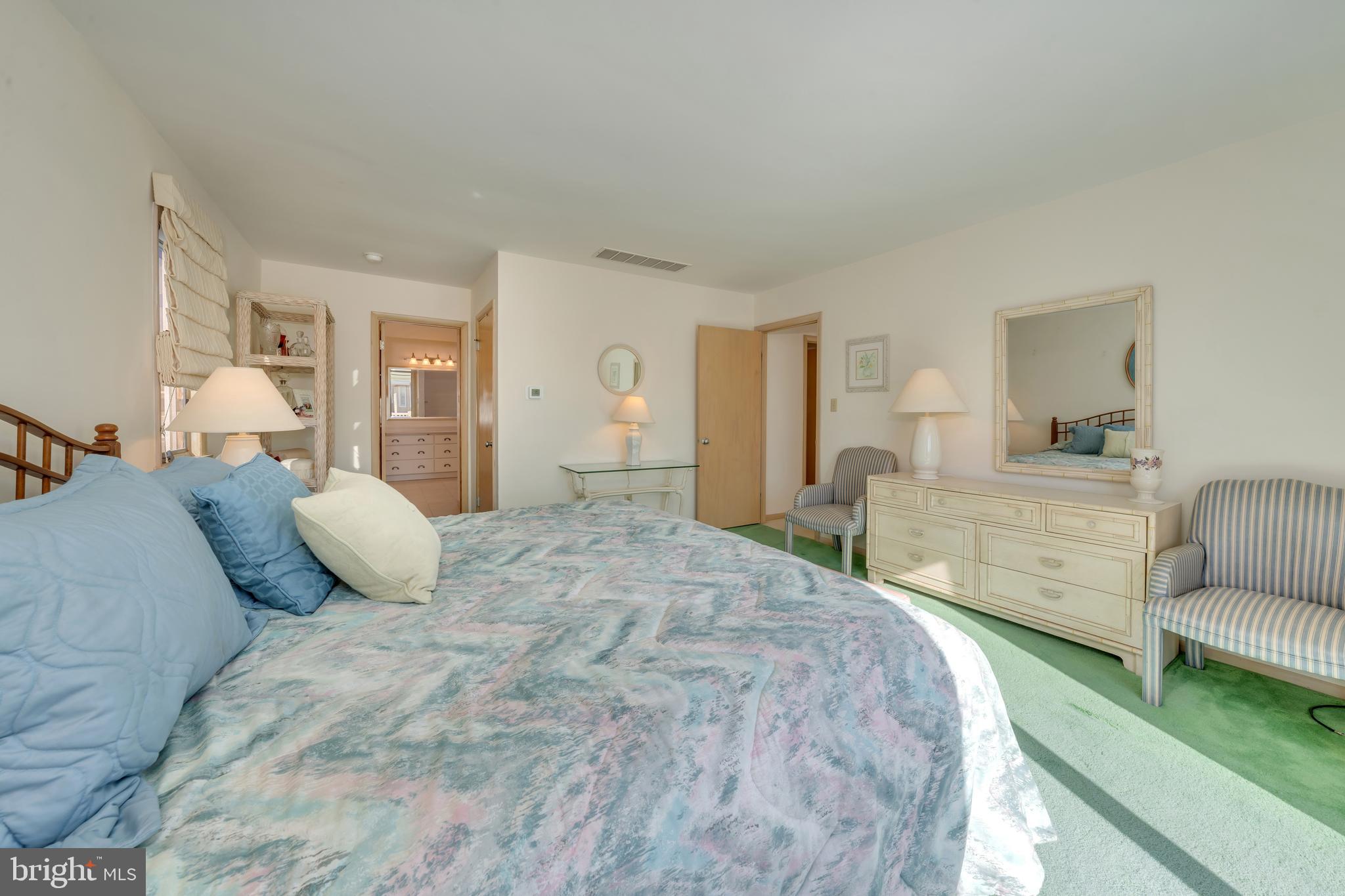 177 74th Street Avalon, NJ 08202 - Photo 49 of 54 a bedroom with a large bed and a couch