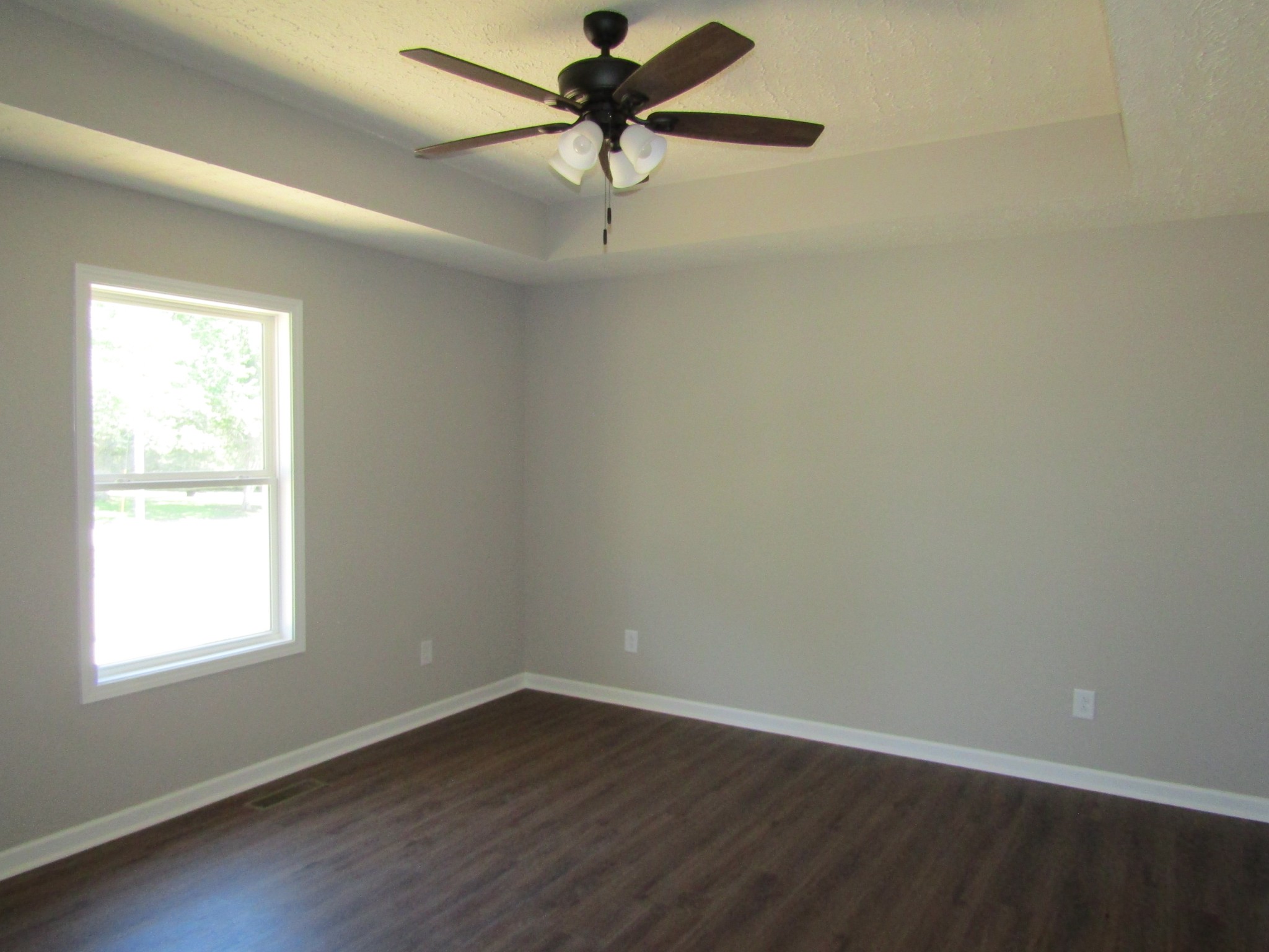 460 Crescent Factory Road Lawrenceburg, TN 38464 - Photo 8 of 13 wooden floor in an empty room with a window