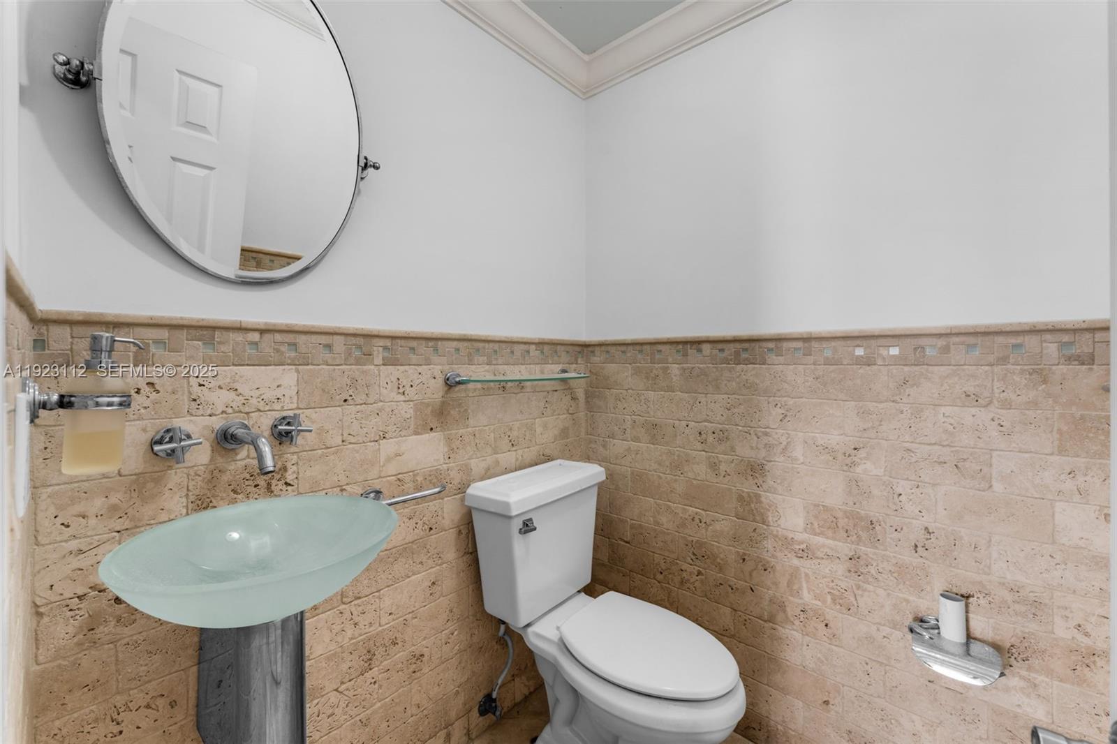 15016 Southwest 139th Avenue Miami, FL 33186 - Photo 12 of 24 a bathroom with a toilet sink and mirror
