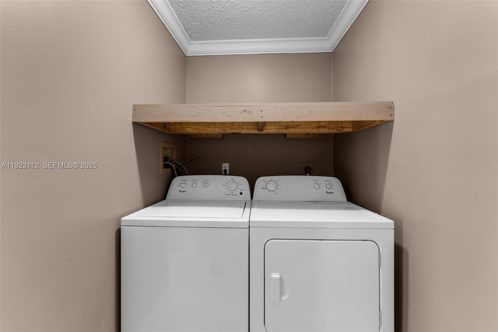 15016 Southwest 139th Avenue Miami, FL 33186 - Photo 19 of 24 a utility room with dryer and washer