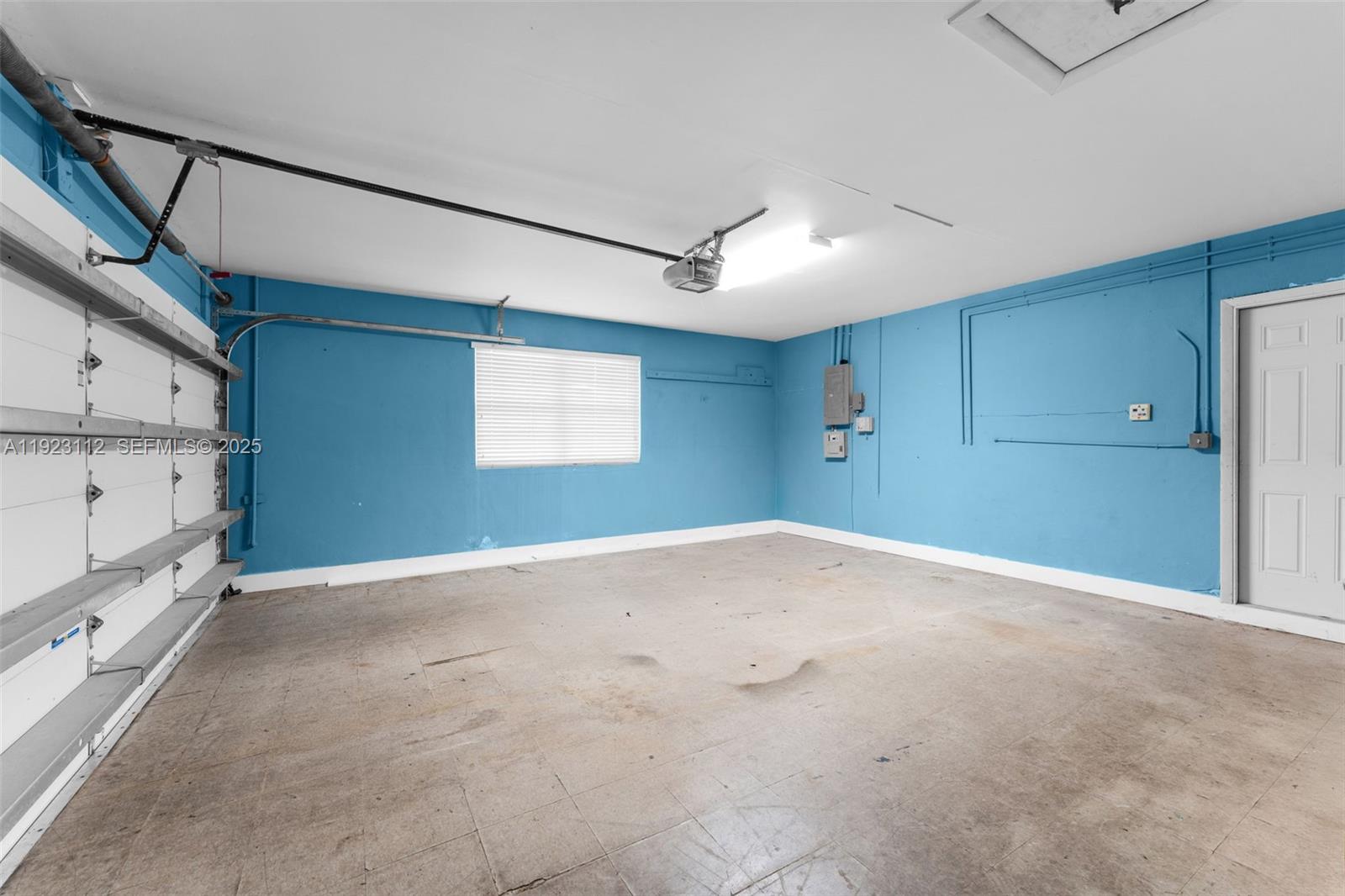 15016 Southwest 139th Avenue Miami, FL 33186 - Photo 20 of 24 a view of empty room with window and fireplace