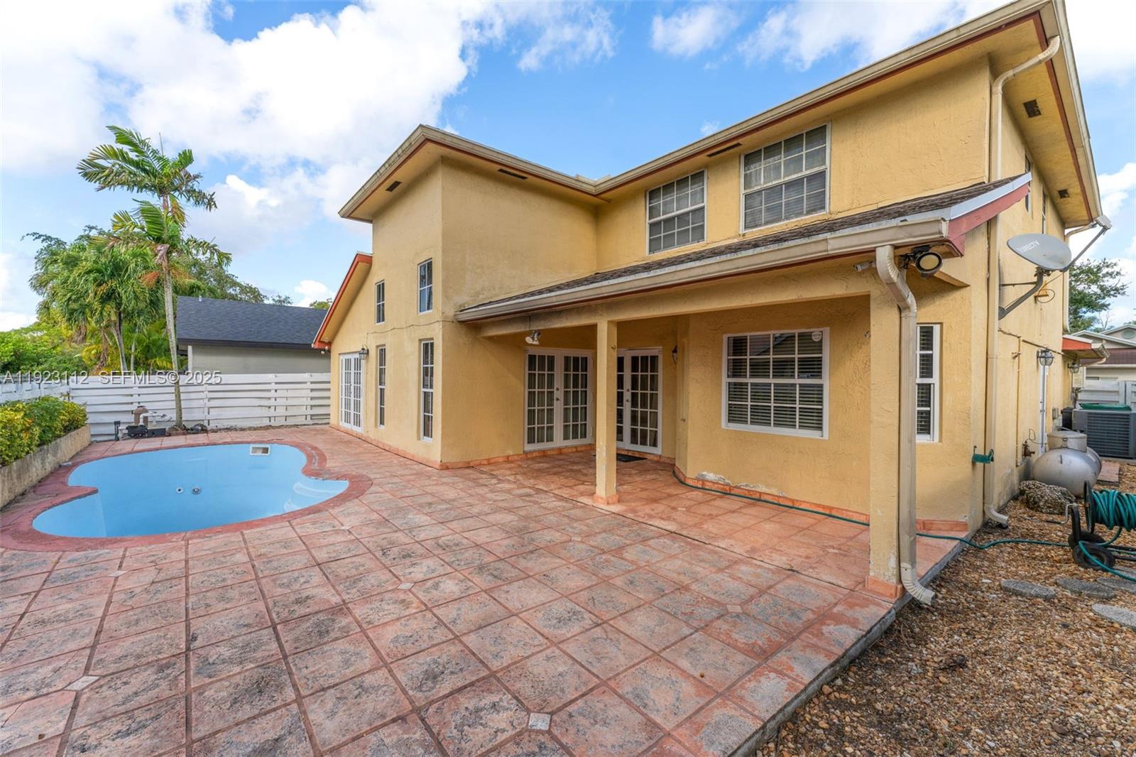 15016 Southwest 139th Avenue Miami, FL 33186 - Photo 21 of 24 a view of a house with backyard and sitting area