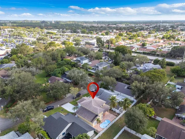 an aerial view of residential houses with outdoor space