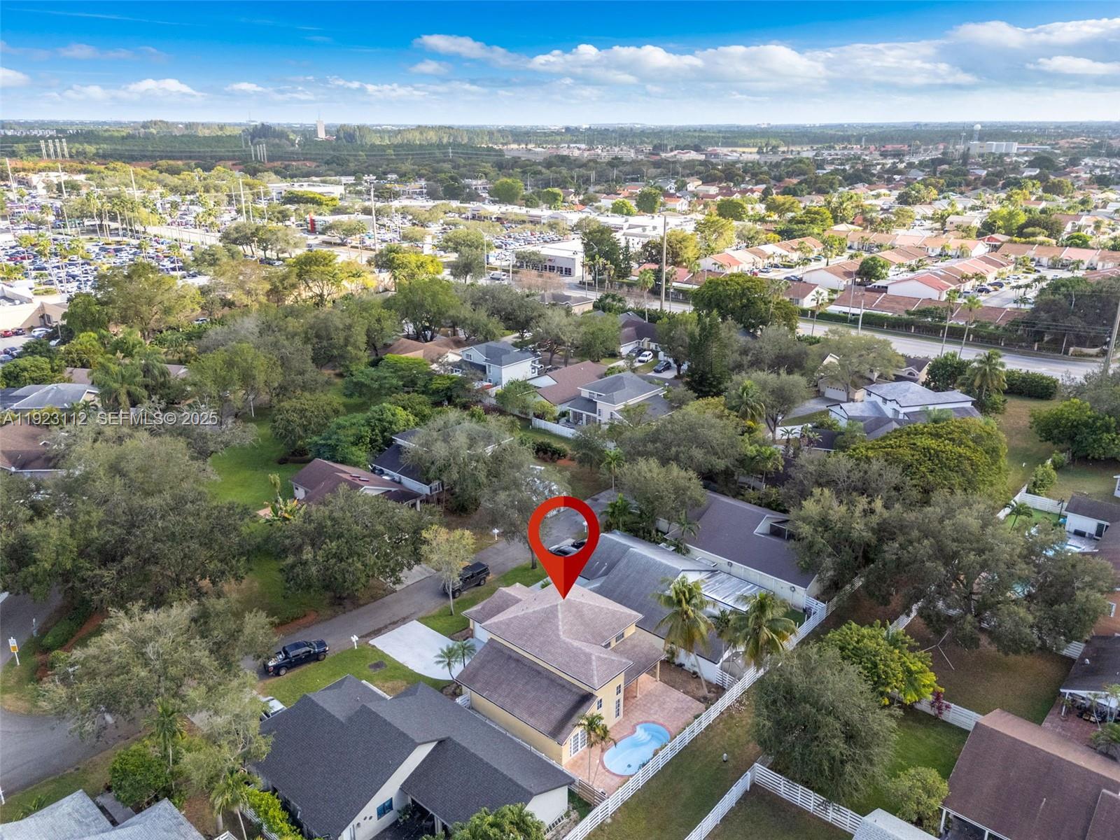 15016 Southwest 139th Avenue Miami, FL 33186 - Photo 23 of 24 an aerial view of residential building with outdoor space and ocean view