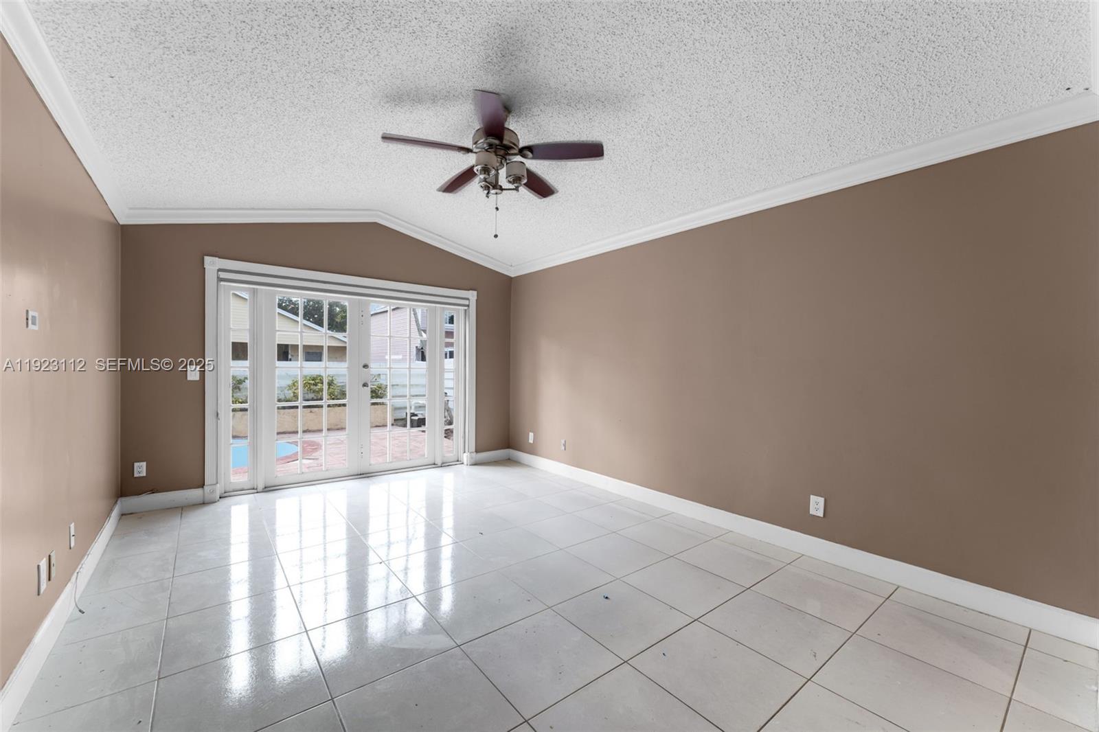 15016 Southwest 139th Avenue Miami, FL 33186 - Photo 8 of 24 a view of an empty room with a window