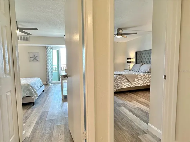 a view of bedroom with wooden floor