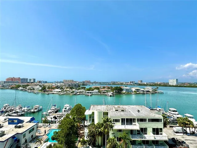 a view of a lake with a car park in front of it