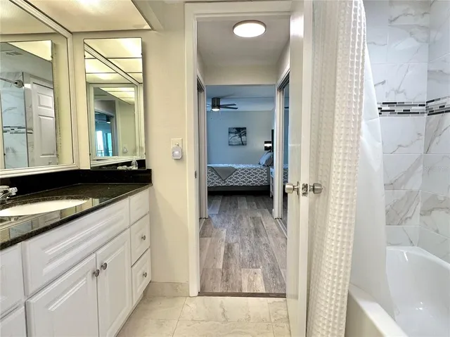 a en suite bathroom with a sink and a mirror