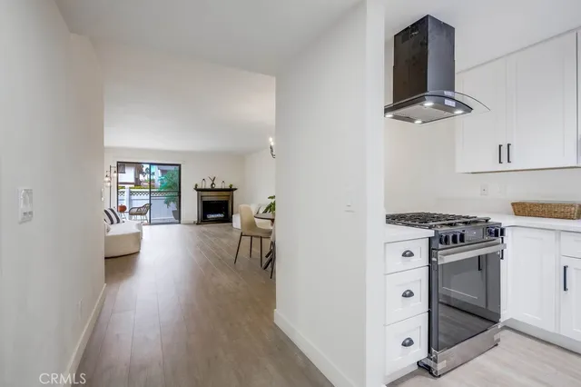 a kitchen with cabinets and appliances
