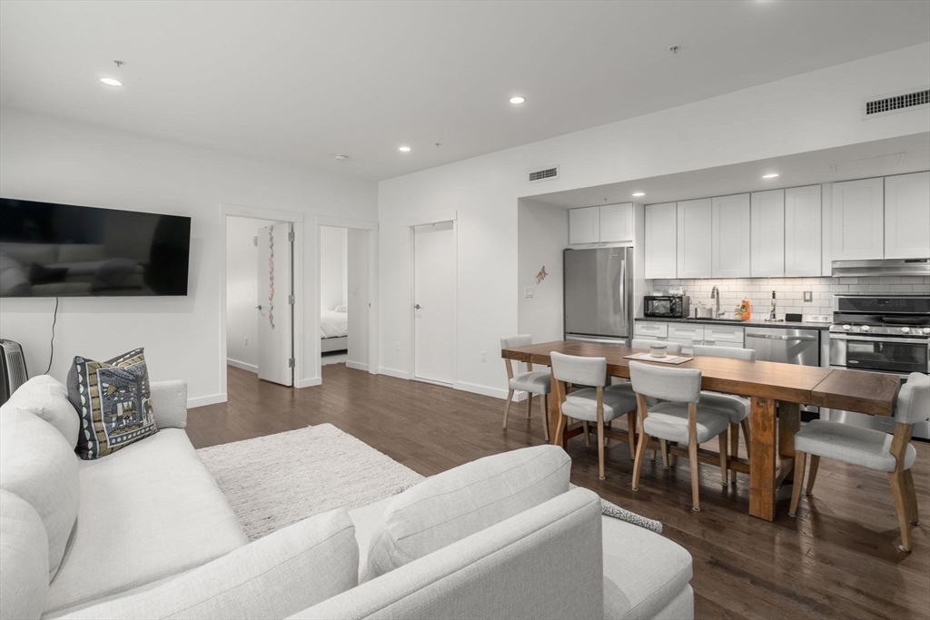 126 Salem Street, Unit 3 Boston, MA 02113 - Photo 1 of 27 a living room with furniture and a flat screen tv