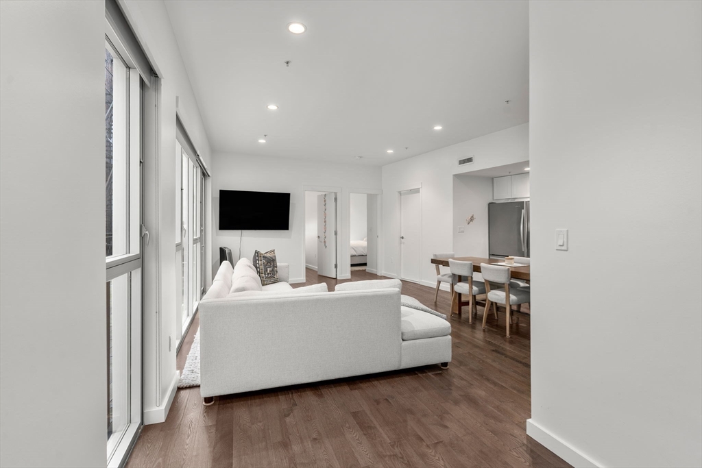 126 Salem Street, Unit 3 Boston, MA 02113 - Photo 12 of 27 a living room with furniture and a flat screen tv