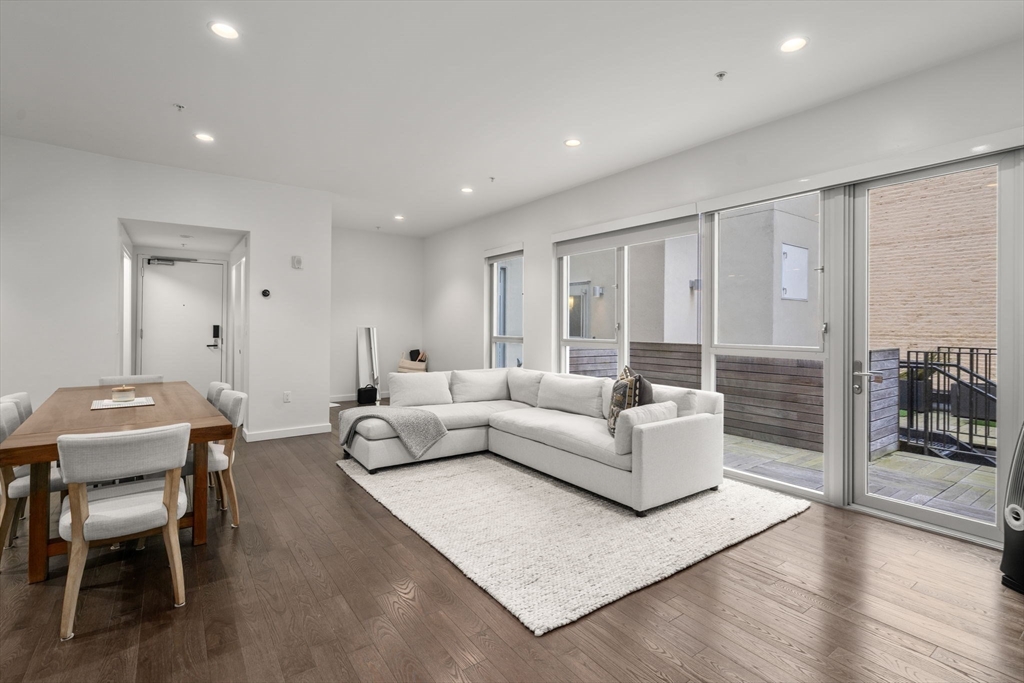 126 Salem Street, Unit 3 Boston, MA 02113 - Photo 13 of 27 a living room with furniture and wooden floor