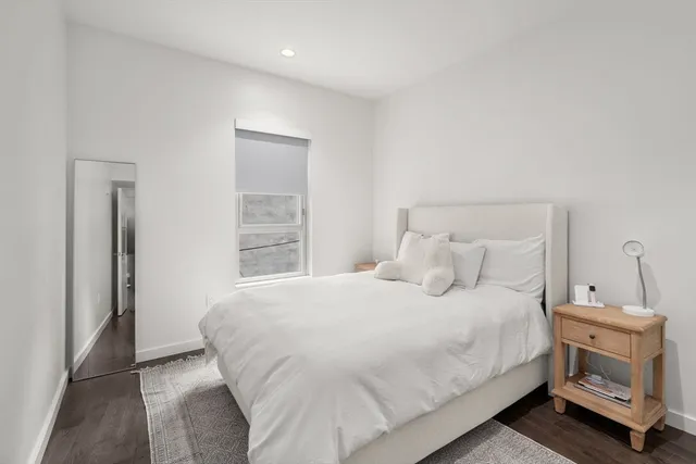 a bedroom with a bed and a fireplace