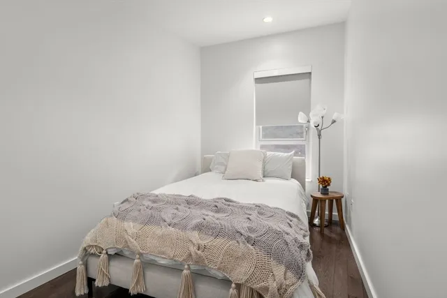 a bedroom with a bed and a table