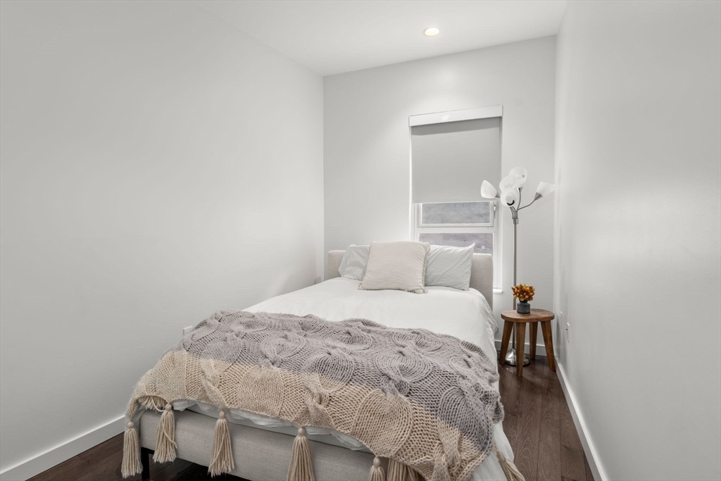 126 Salem Street, Unit 3 Boston, MA 02113 - Photo 9 of 27 a bedroom with a bed and a table