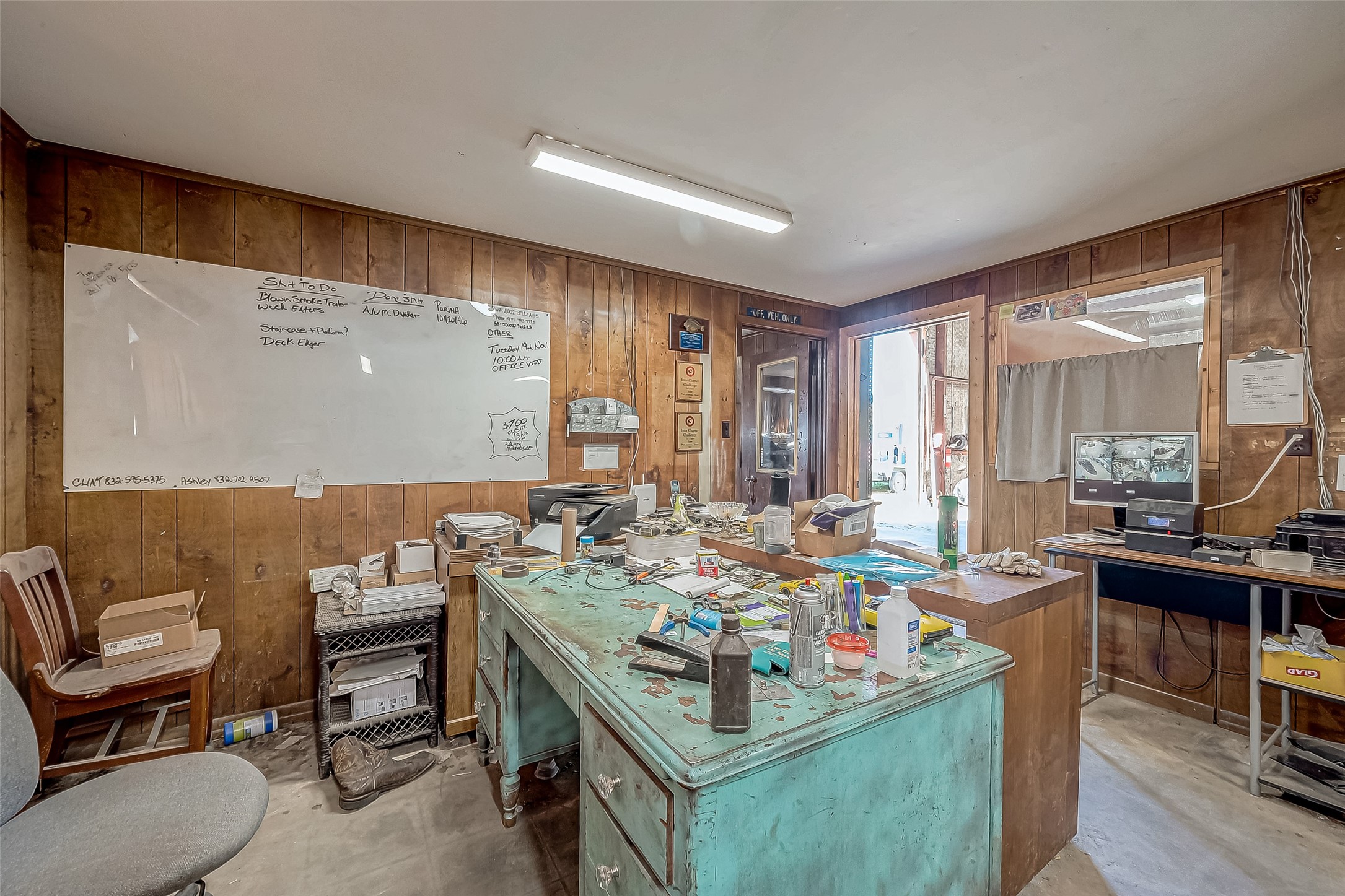 8231 Main Street Needville, TX 77461 - Photo 18 of 43 a view of a work space with furniture and window