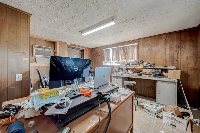 a workspace with furniture and a window