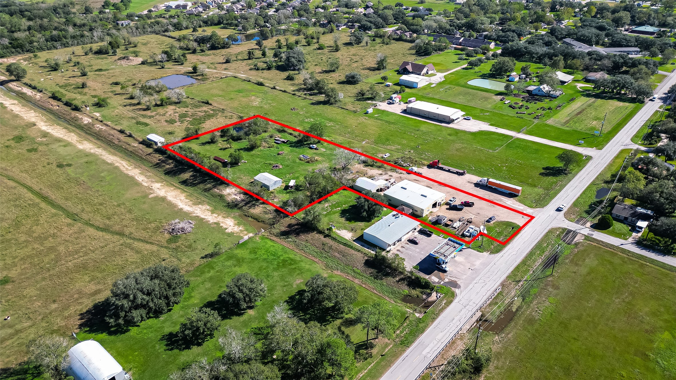 8231 Main Street Needville, TX 77461 - Photo 2 of 43 an aerial view of a city