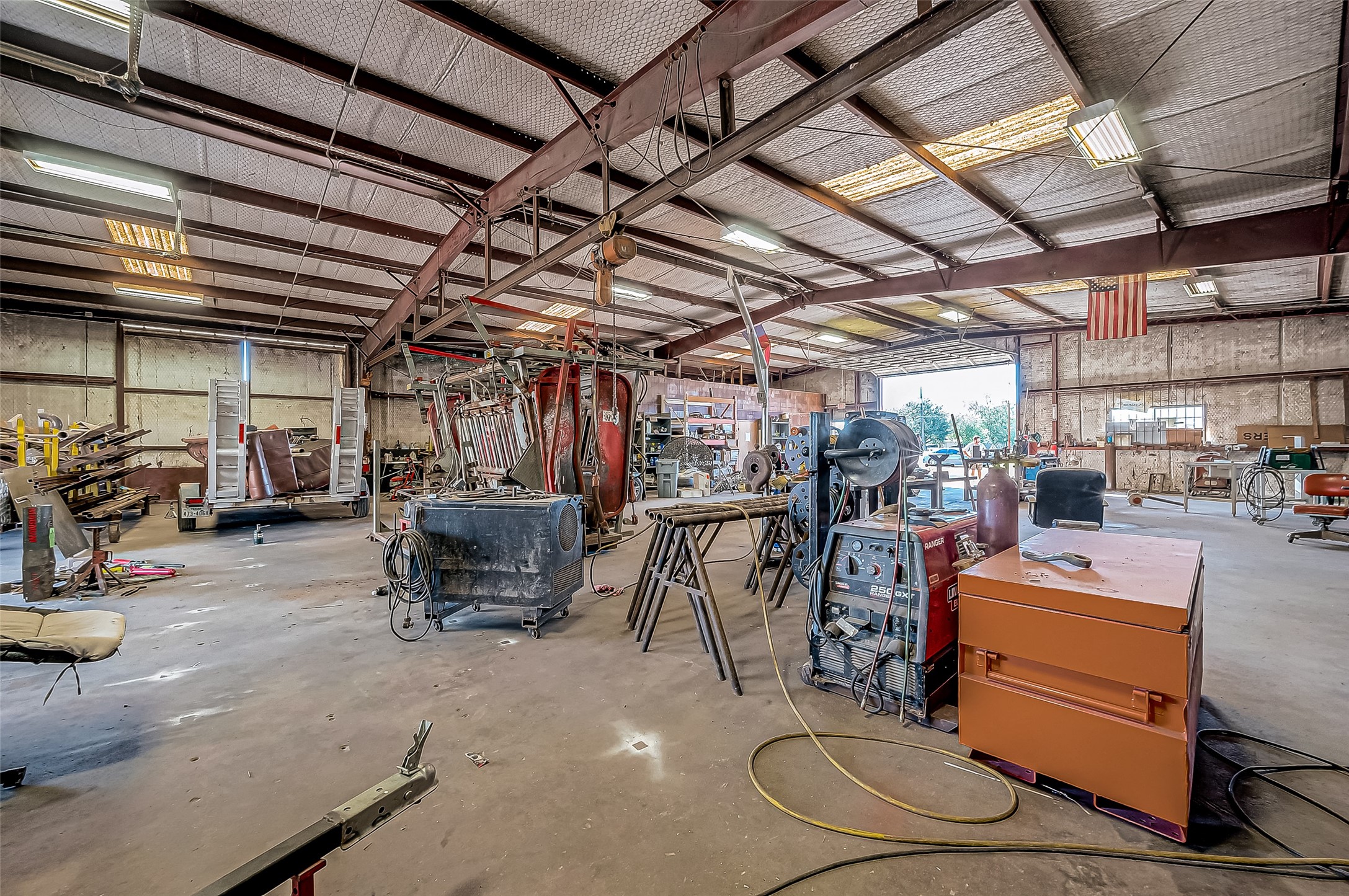 8231 Main Street Needville, TX 77461 - Photo 25 of 43 a view of a storage room with racks