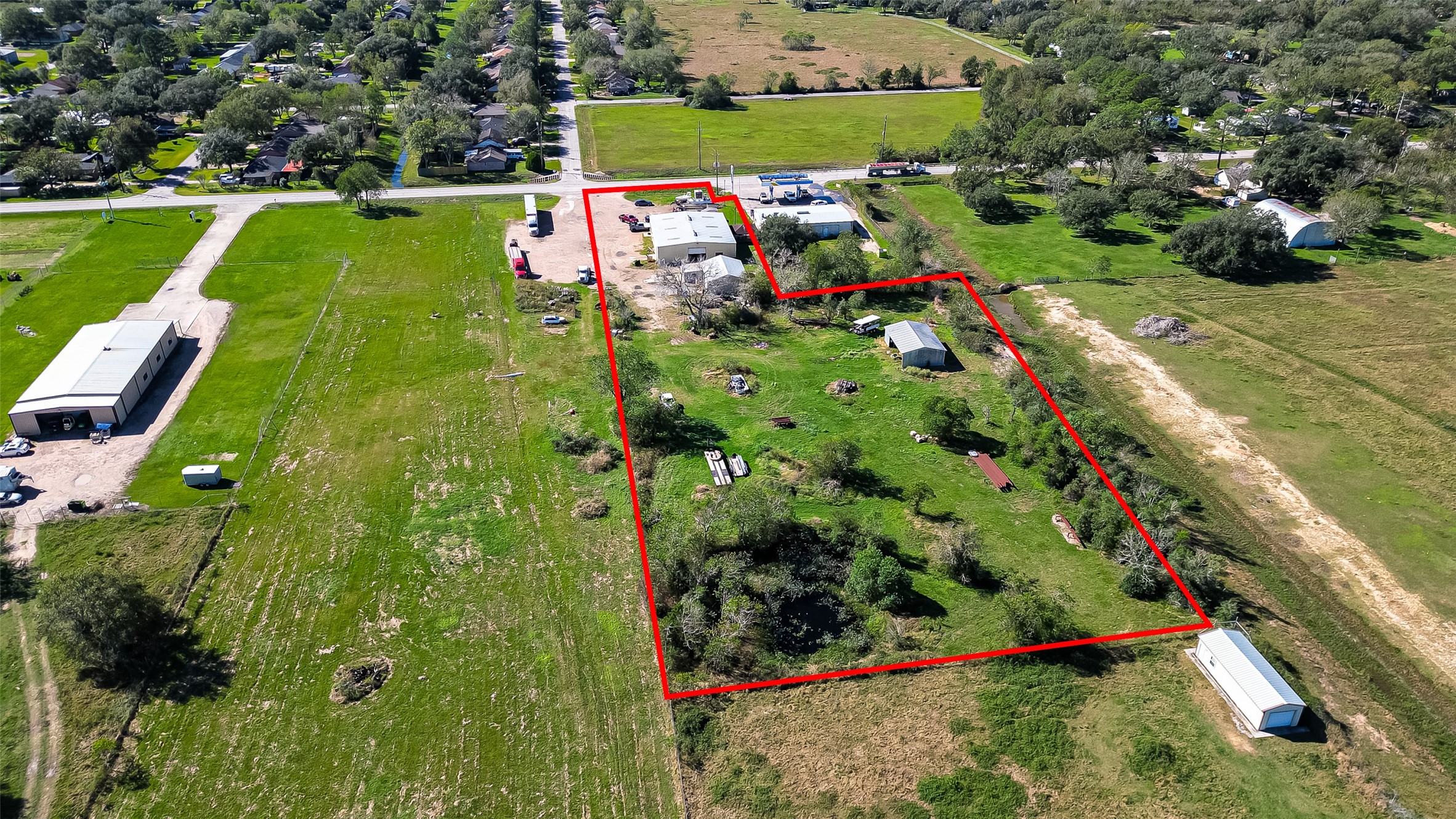 8231 Main Street Needville, TX 77461 - Photo 34 of 43 an aerial view of a golf course with street view