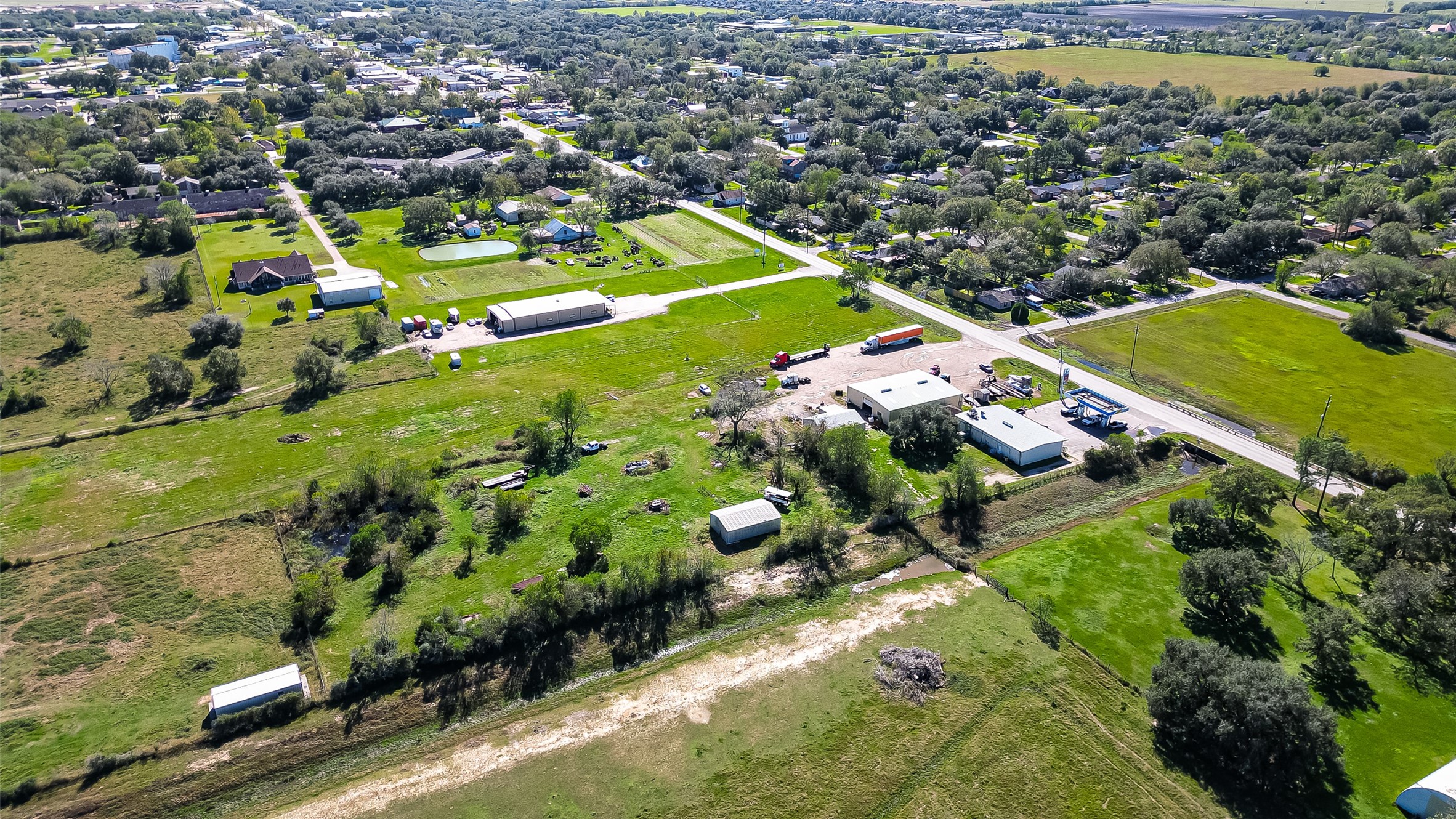 8231 Main Street Needville, TX 77461 - Photo 38 of 43 an aerial view of a residential houses with outdoor space