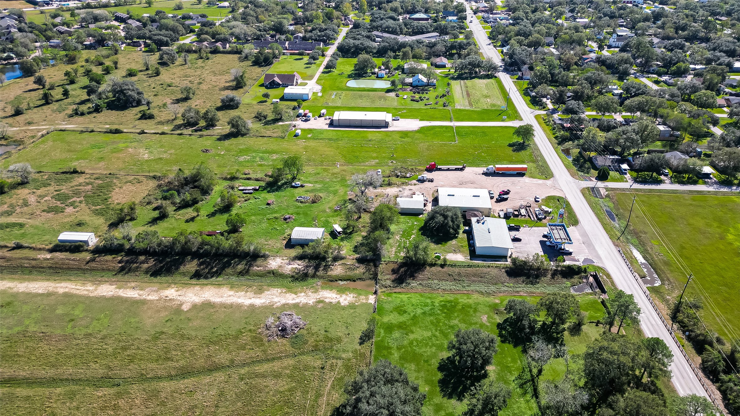 8231 Main Street Needville, TX 77461 - Photo 39 of 43 a view of a swimming pool with a yard