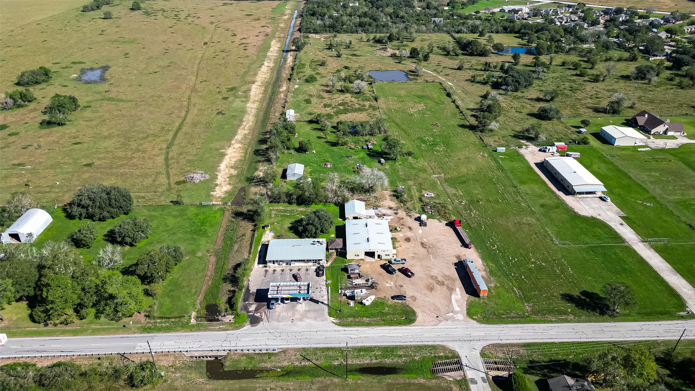8231 Main Street Needville, TX 77461 - Photo 42 of 43 an aerial view of residential houses with outdoor space