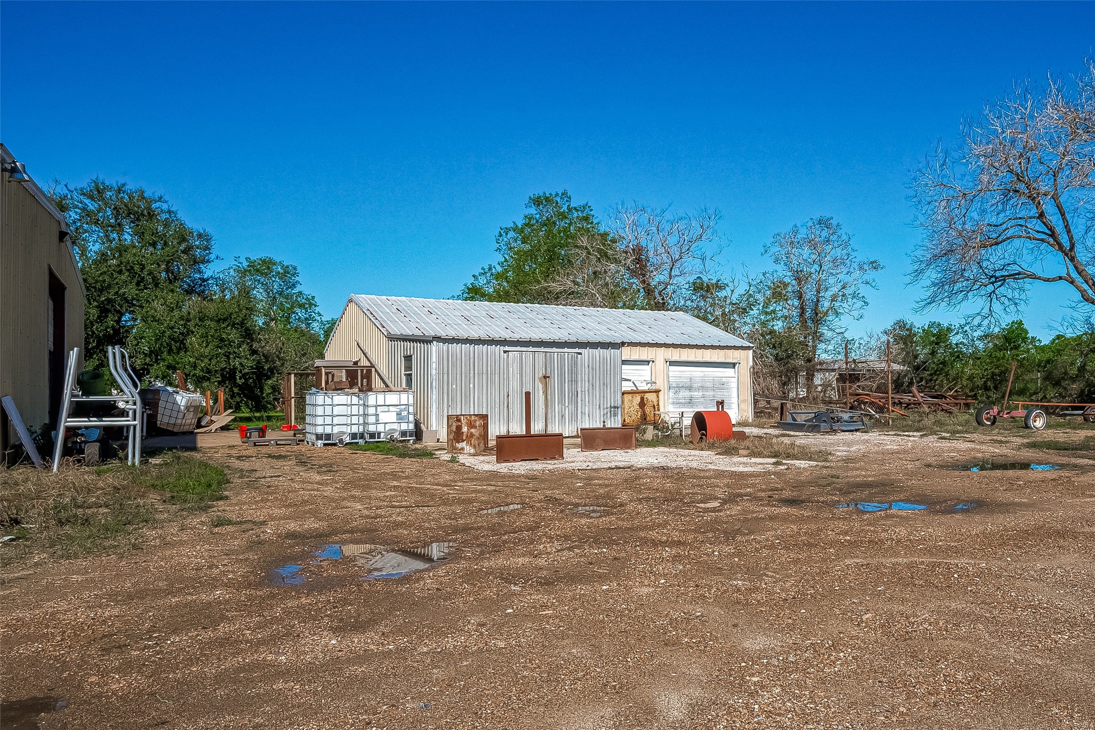 8231 Main Street Needville, TX 77461 - Photo 9 of 43 a view of a house with backyard and sitting area