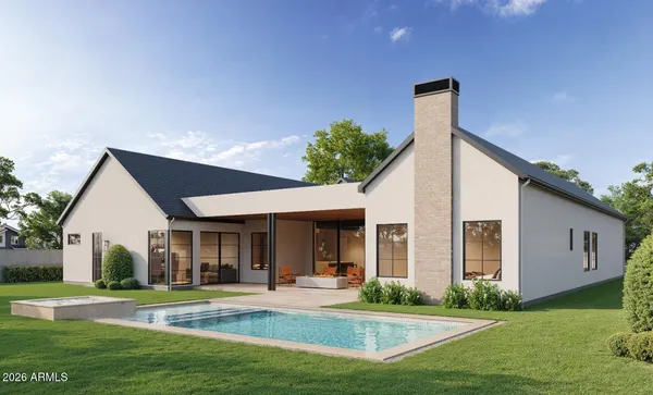 a living room with furniture kitchen view and a flat screen tv