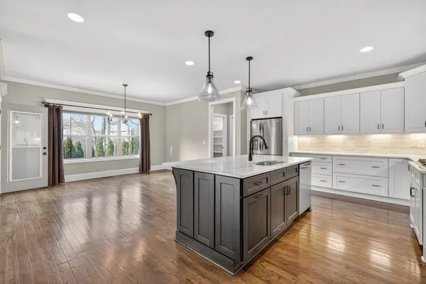 a kitchen with a stove and a sink