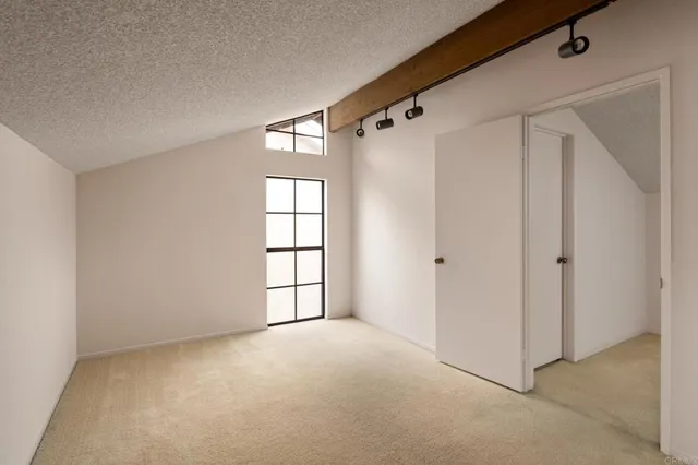 a bathroom with a toilet a sink and shower