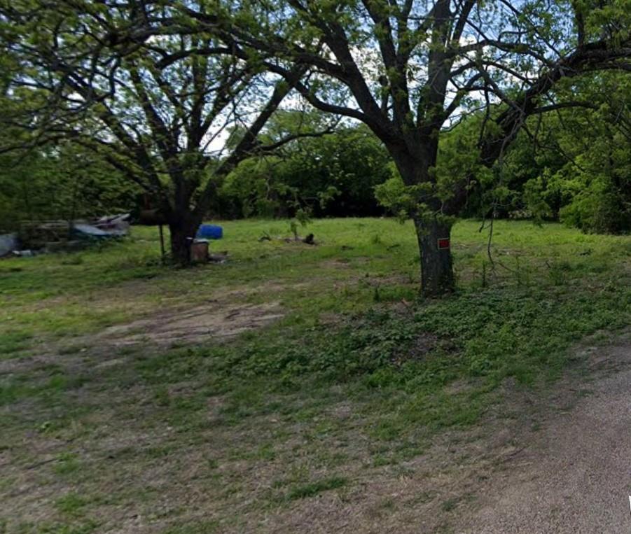 104 Short Street Grandview, TX 76050 - Photo 2 of 3 a view of a tree in a yard