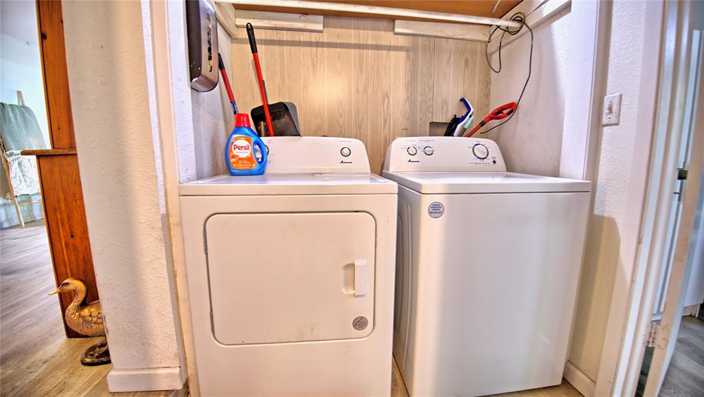 140 Elm Road Nocona, TX 76255 - Photo 17 of 26 a utility room with dryer and washer