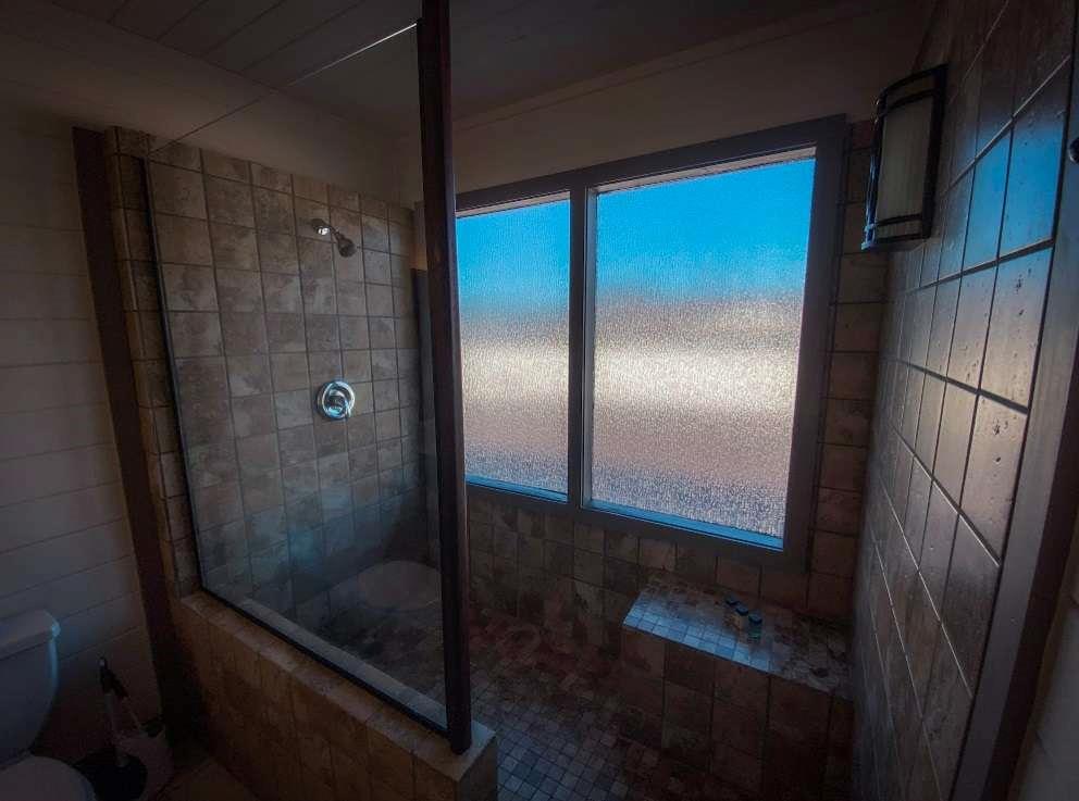544 East Main Street, Unit 2 Blue Ridge, GA 30513 - Photo 14 of 19 a bathroom with a glass shower door