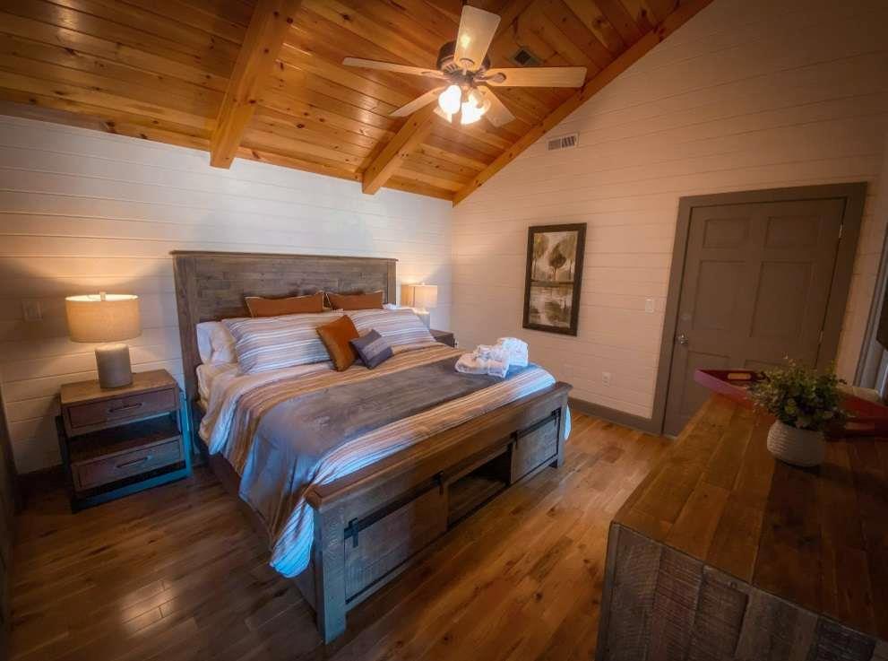 544 East Main Street, Unit 2 Blue Ridge, GA 30513 - Photo 6 of 19 a bedroom with bed and wooden floor