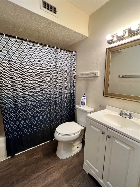 2406 Toro Lane, Unit D Bryan, TX 77807 - Photo 11 of 12 a bathroom with a sink toilet and mirror