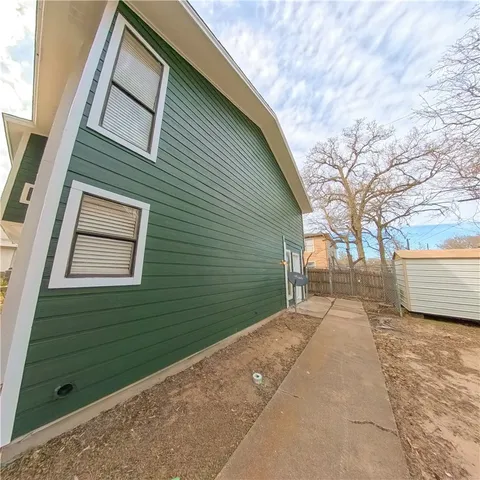 a view of a backyard of the house