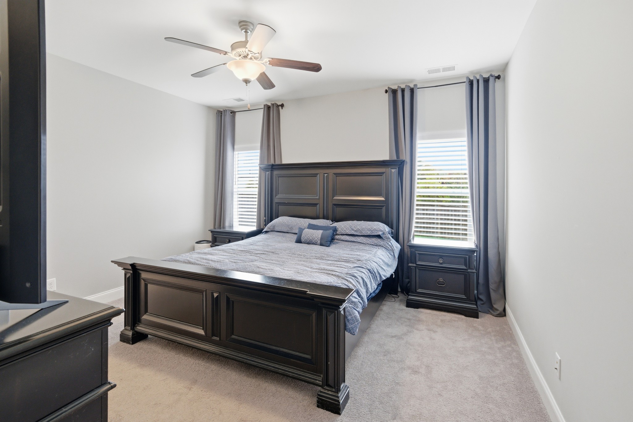 1319 Coates Lane Gallatin, TN 37066 - Photo 17 of 32 a bedroom with a bed and a chandelier
