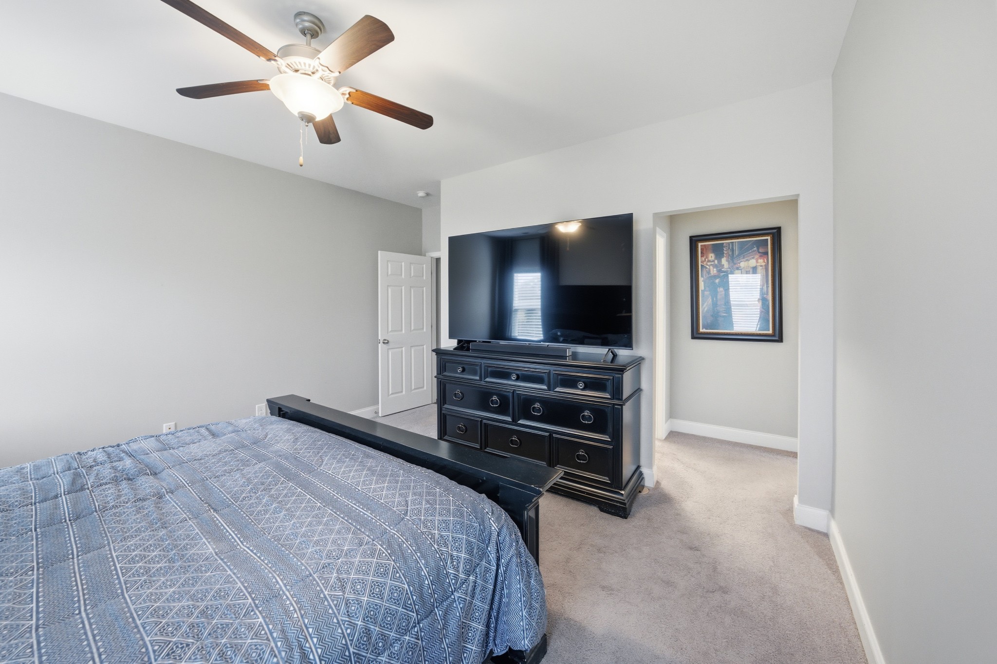 1319 Coates Lane Gallatin, TN 37066 - Photo 18 of 32 a bedroom with a bed and a flat screen tv