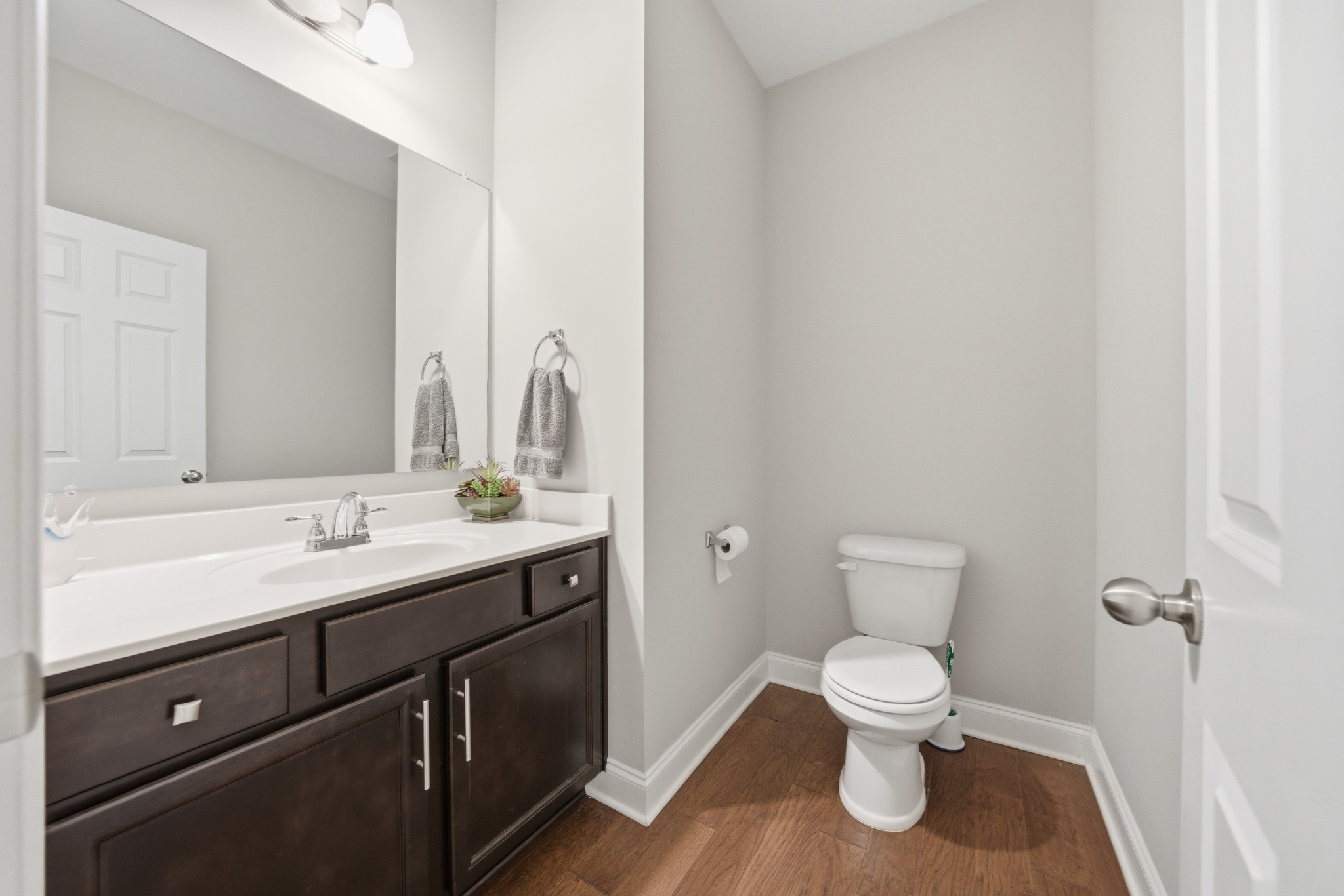 1319 Coates Lane Gallatin, TN 37066 - Photo 25 of 32 a bathroom with a granite countertop toilet sink and mirror