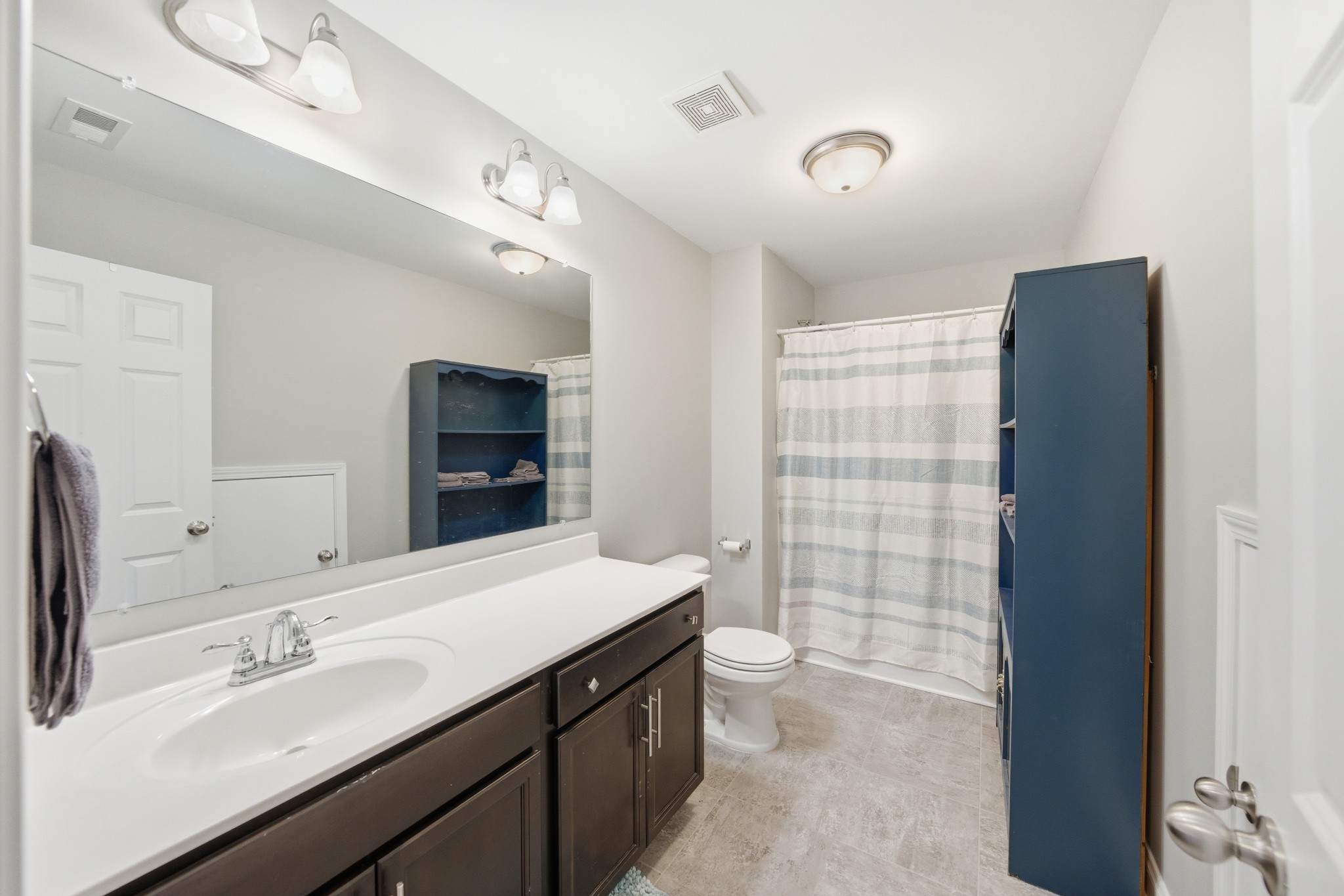 1319 Coates Lane Gallatin, TN 37066 - Photo 30 of 32 a bathroom with a double vanity sink toilet and shower