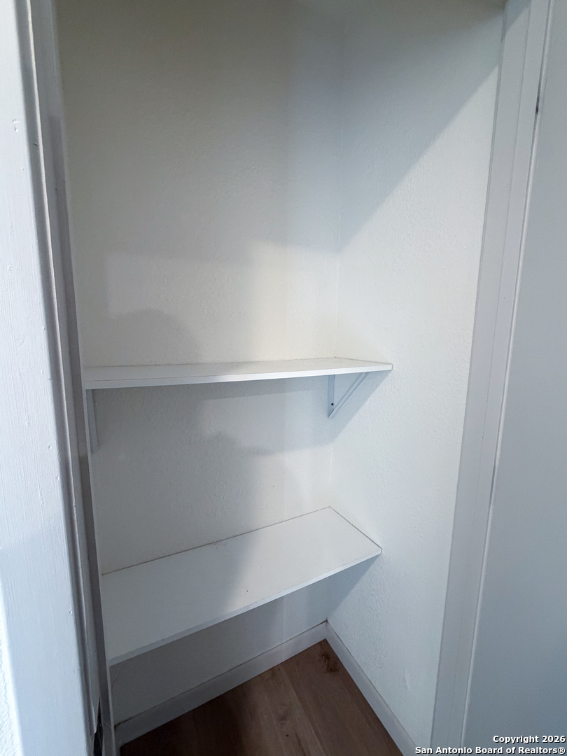 409 Coughran Street Pleasanton, TX 78064 - Photo 13 of 16 a view of an empty walk in closet