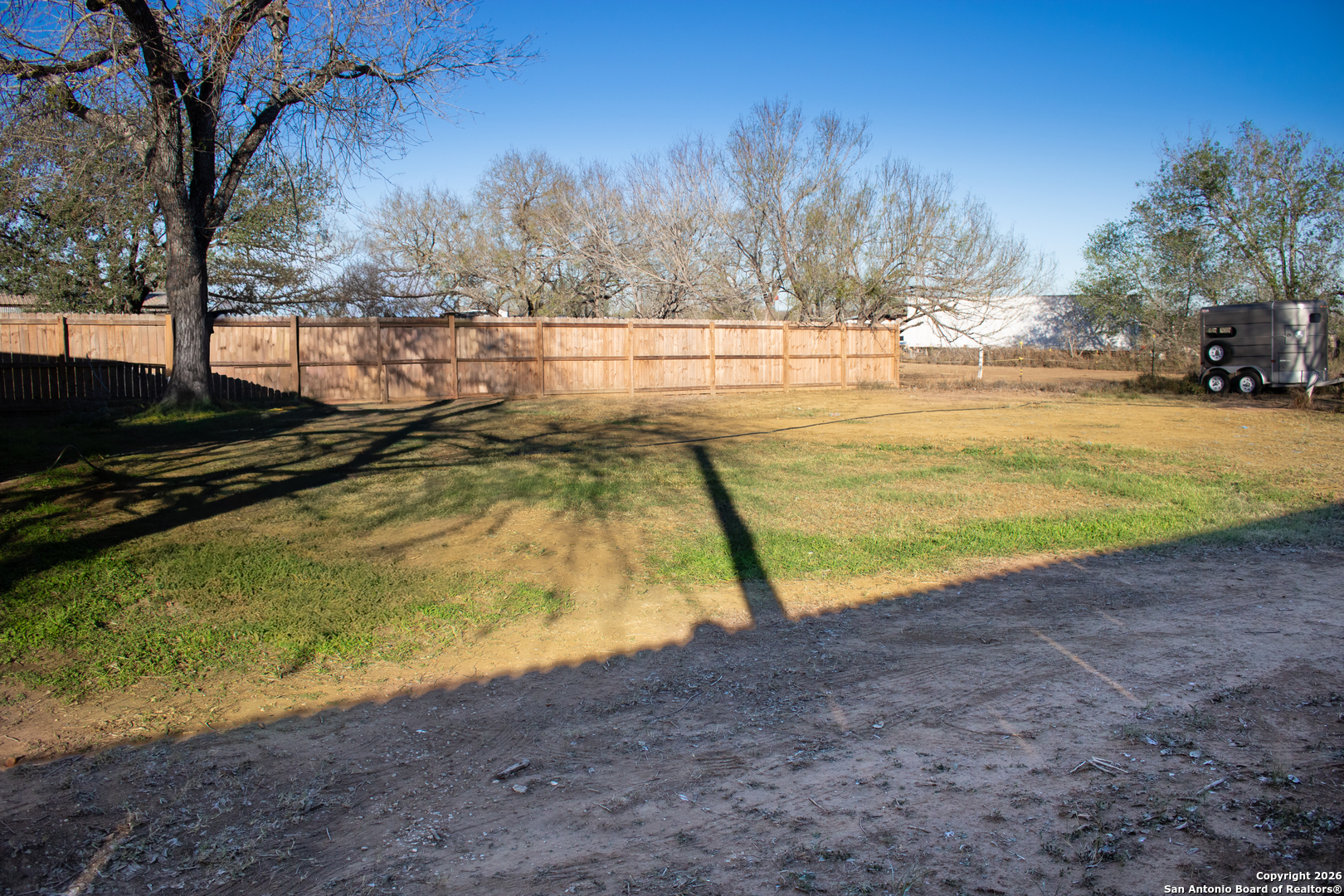 409 Coughran Street Pleasanton, TX 78064 - Photo 16 of 16 a view of a yard with swimming pool