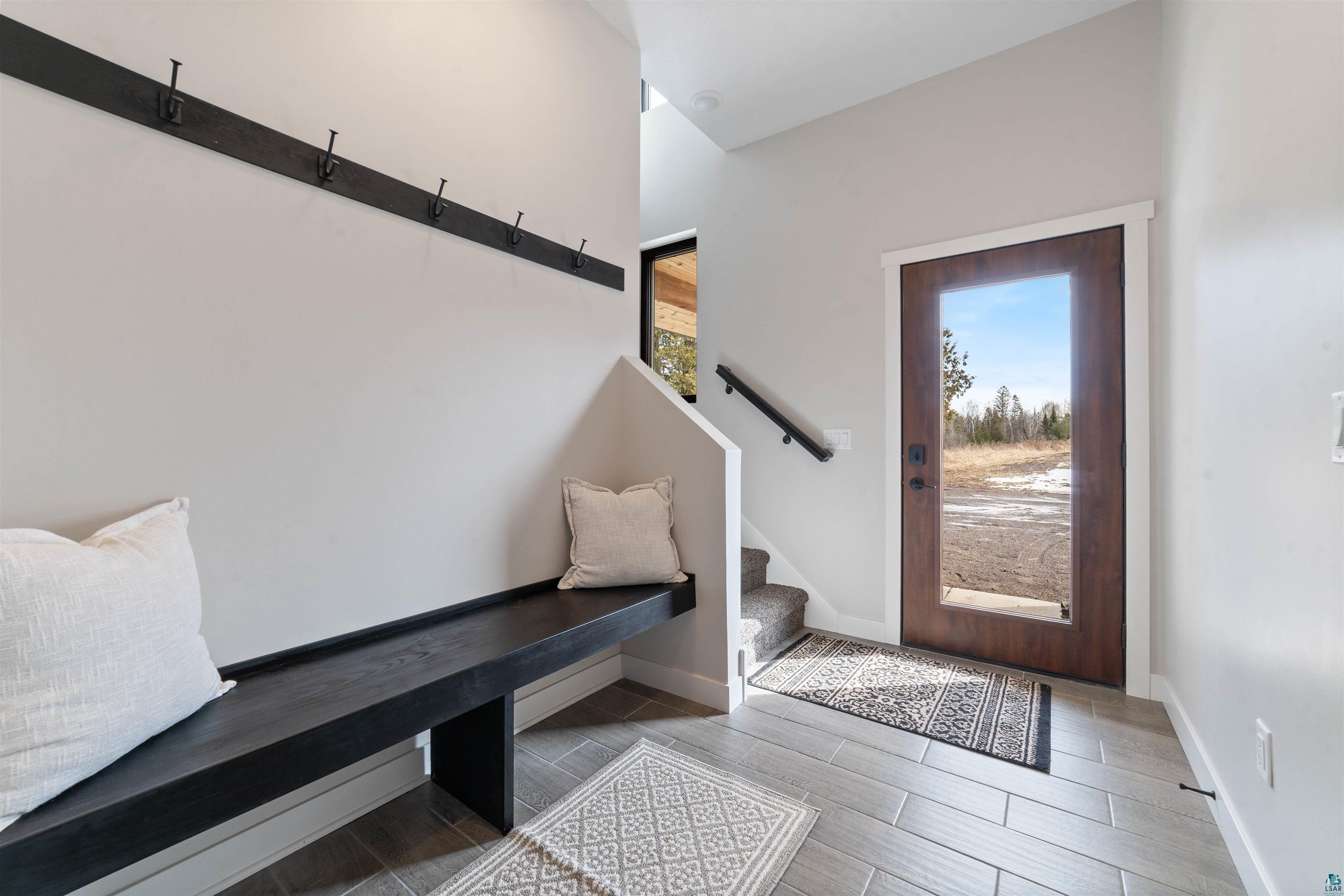 3089 Lavis Road Duluth, MN 55804 - Photo 16 of 30 Entryway featuring baseboards and stairs