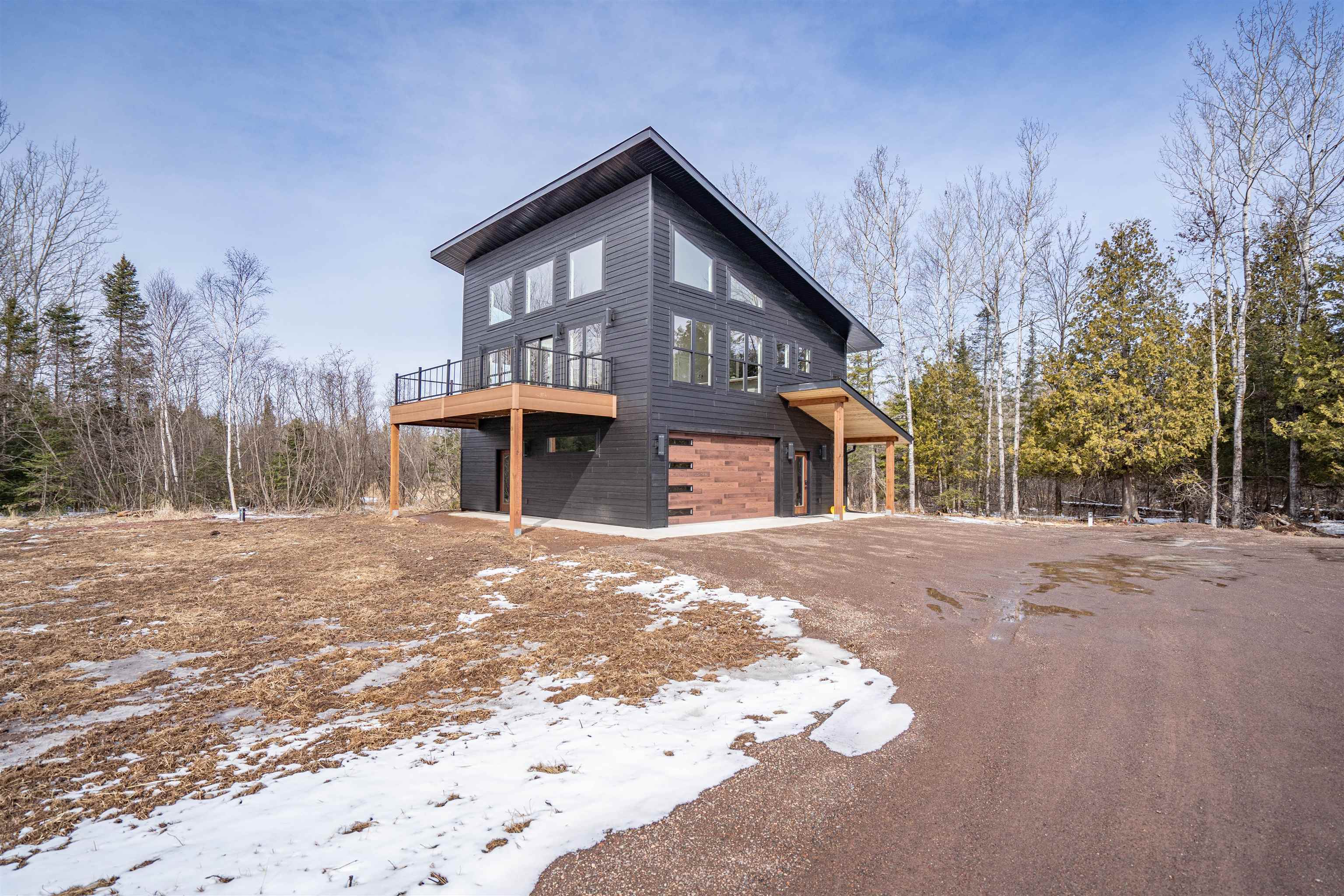 3089 Lavis Road Duluth, MN 55804 - Photo 28 of 30 Snow covered property featuring an attached garage