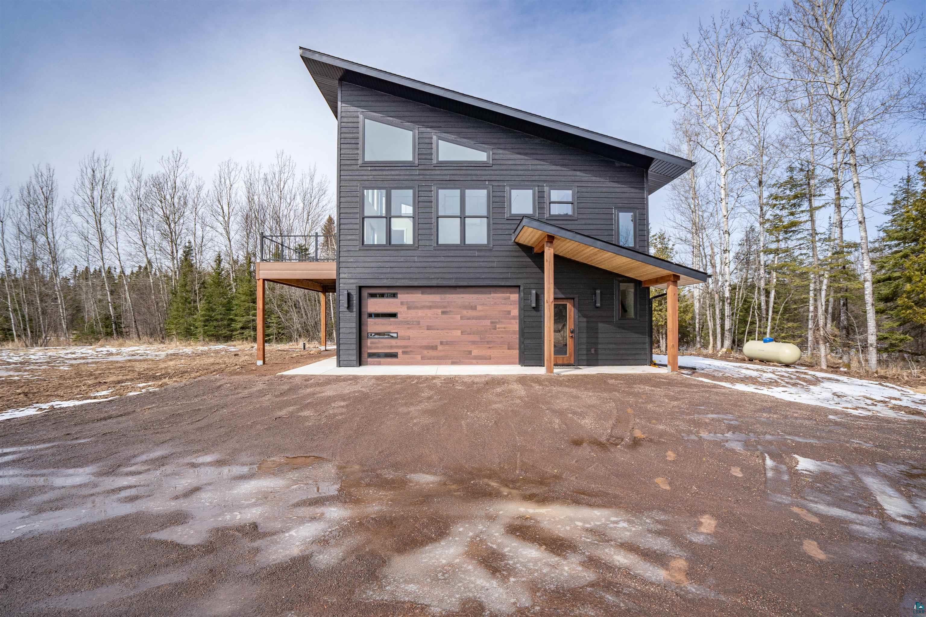 3089 Lavis Road Duluth, MN 55804 - Photo 29 of 30 View of front of house with a garage and dirt driveway