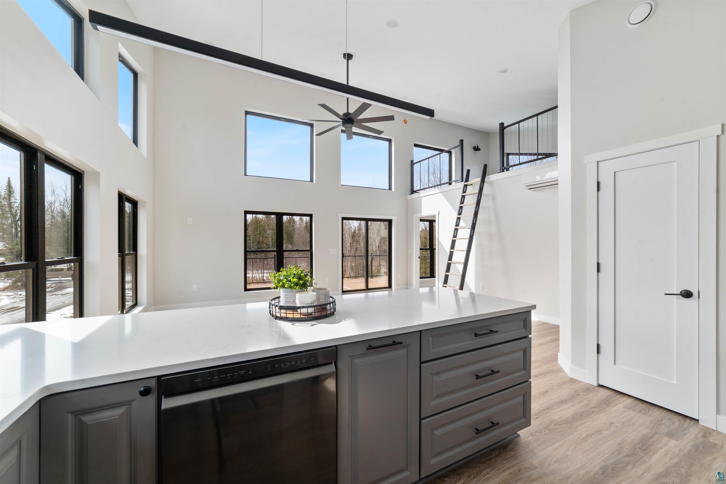 3089 Lavis Road Duluth, MN 55804 - Photo 4 of 30 Kitchen featuring light countertops, dishwasher, a ceiling fan, light wood-style floors, and gray cabinets
