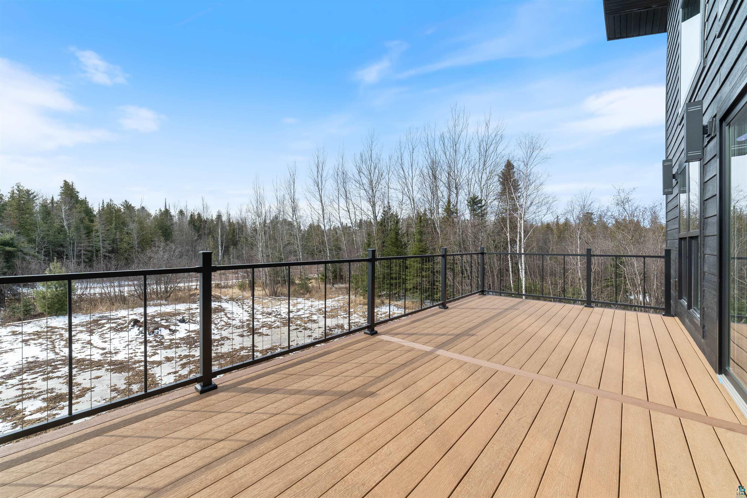 3089 Lavis Road Duluth, MN 55804 - Photo 9 of 30 Snow covered deck featuring a forest view